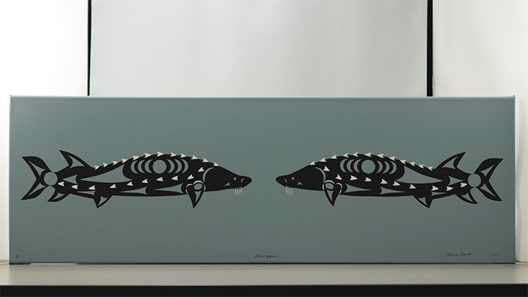 A painting of two sturgeon fish shows the fish facing each other in mirror image. The fish are outlined in black, with white scales along their backs and sides. 