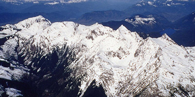 A rocky mountain peak set against the blue sky.